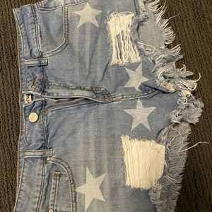 Refuge, high waisted jean shorts with stars.